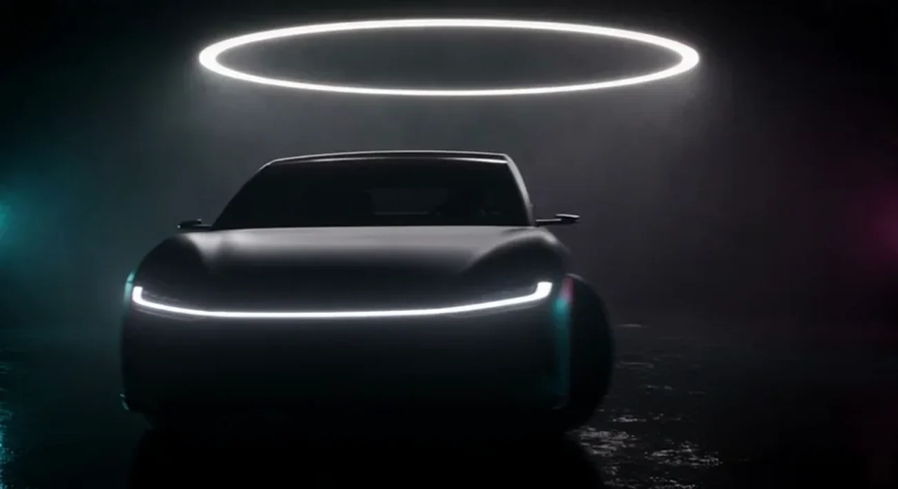 Seedance 2.5 at 3 seconds: the coupe facing the camera with the same clean nose and light bar as the design still